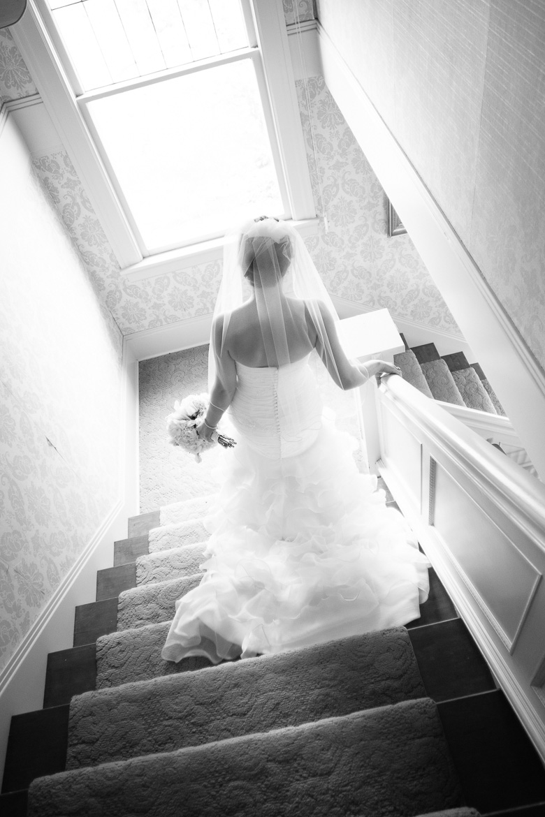 Bride going down stairs before wedding at Lord Hill Farms in Snohomish Washington