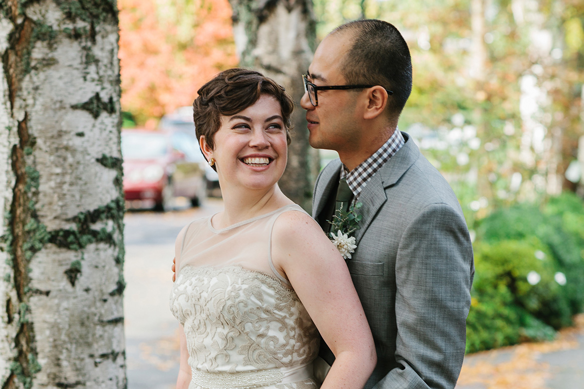 Bride laughing during fall wedding portraits in Seatle, WA