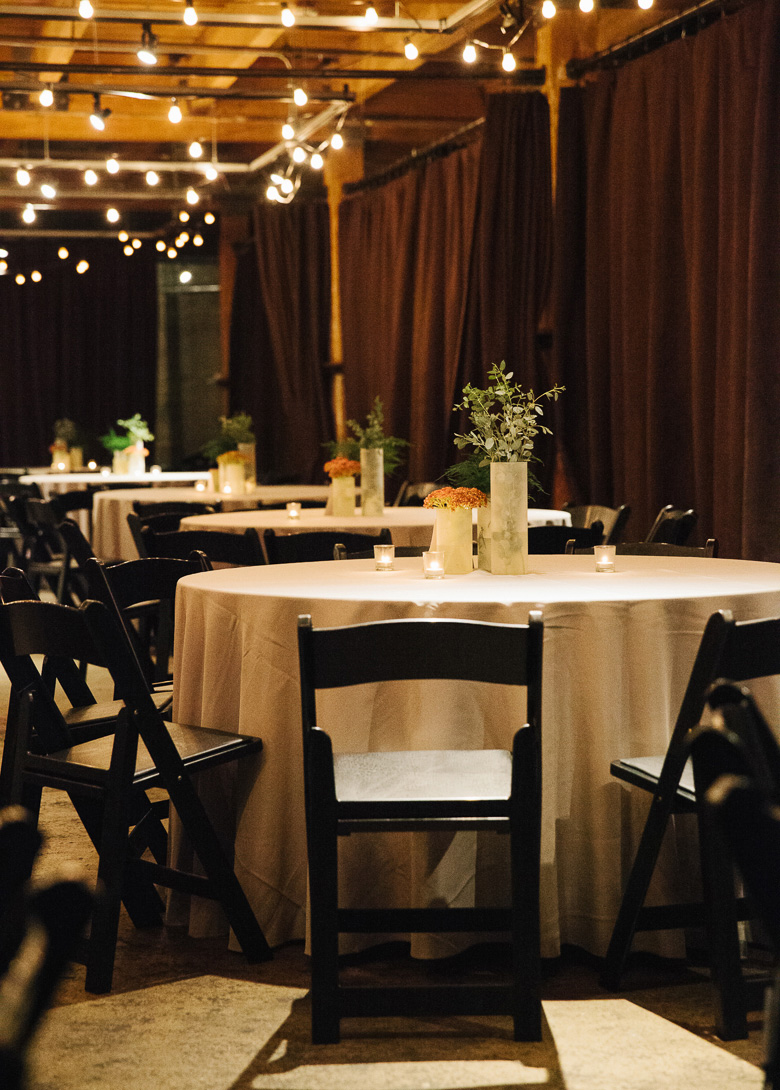 Wedding reception tables and details at fall wedding at Melrose Market Studios in Seattle, WA