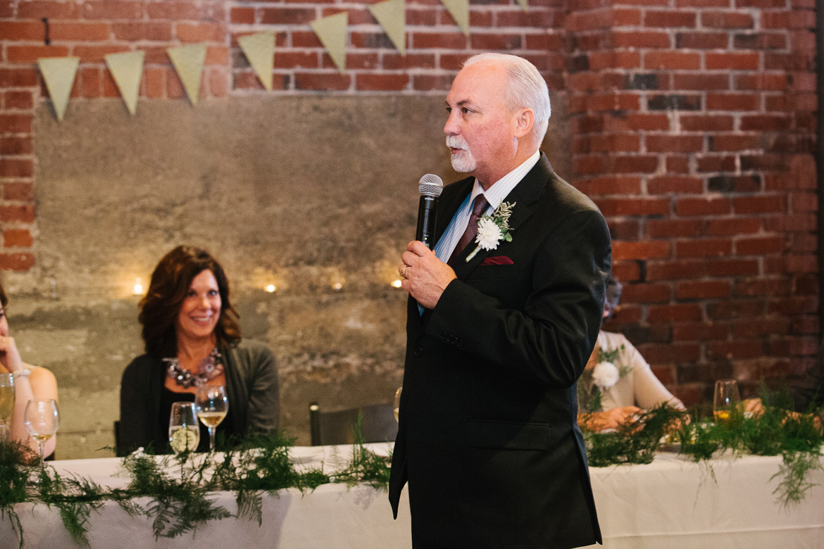Father of the bride during reception toasts at Melrose Market Studios wedding in Seattle, WA