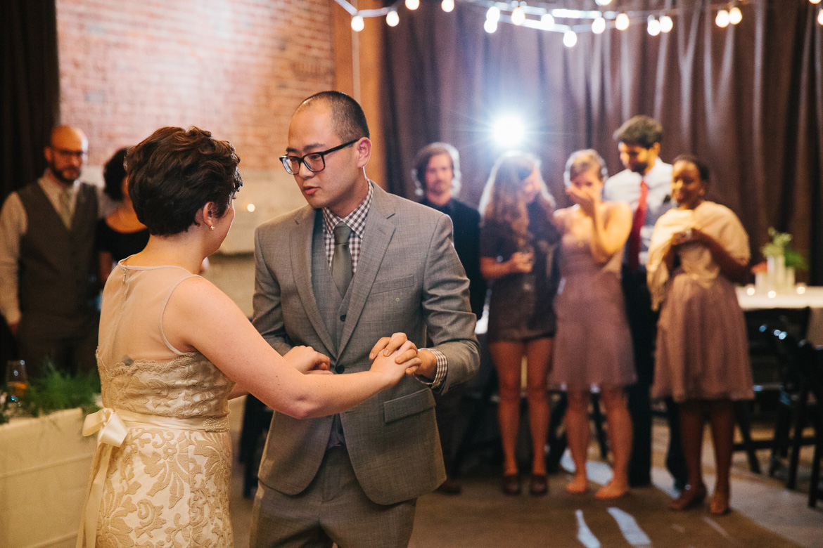 Bride and groom during first dance at Melrose Market Studios wedding in Seattle, WA