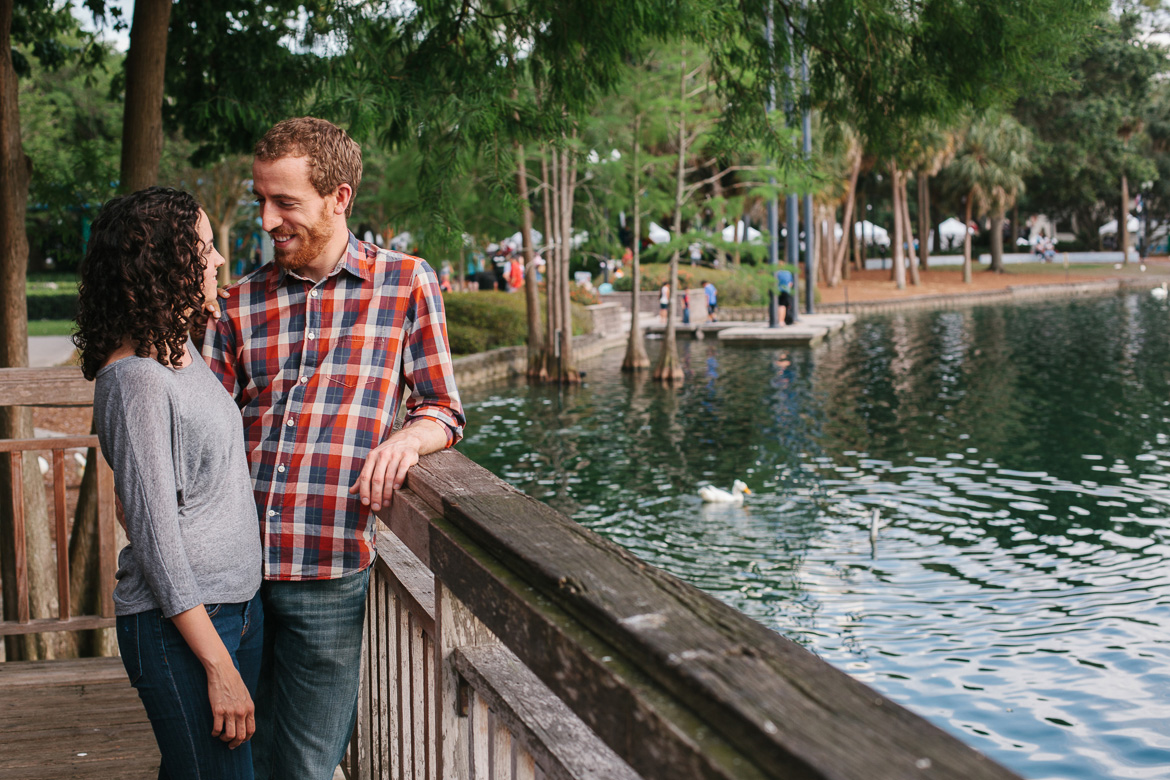 Couple during engagement photo session at Lake Eola Park in Orlando, FL