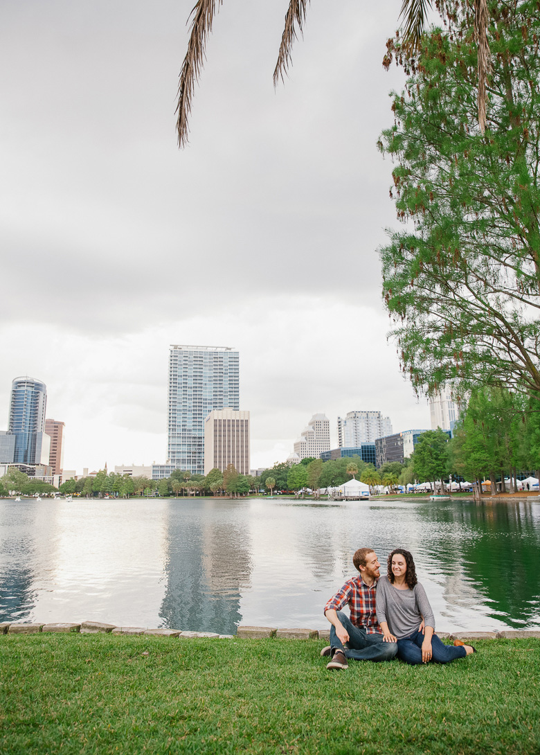 Engagement session at Lake Eola Park with Orlando city skyline