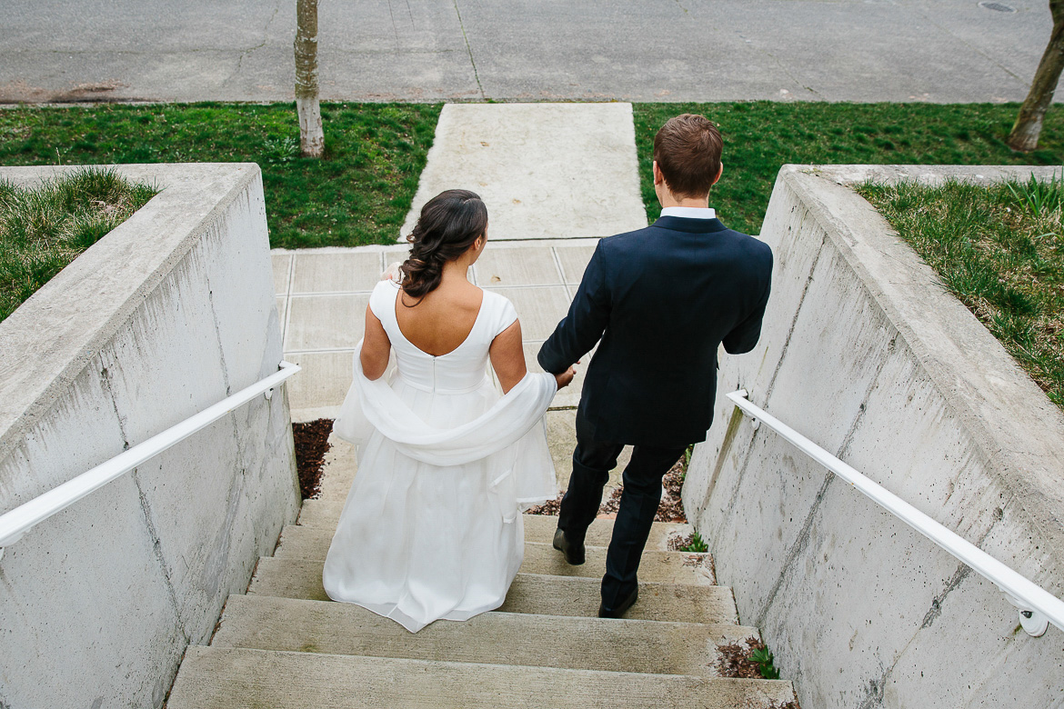 Bride and groom walking down steps on Beacon Hill before Seattle elopement