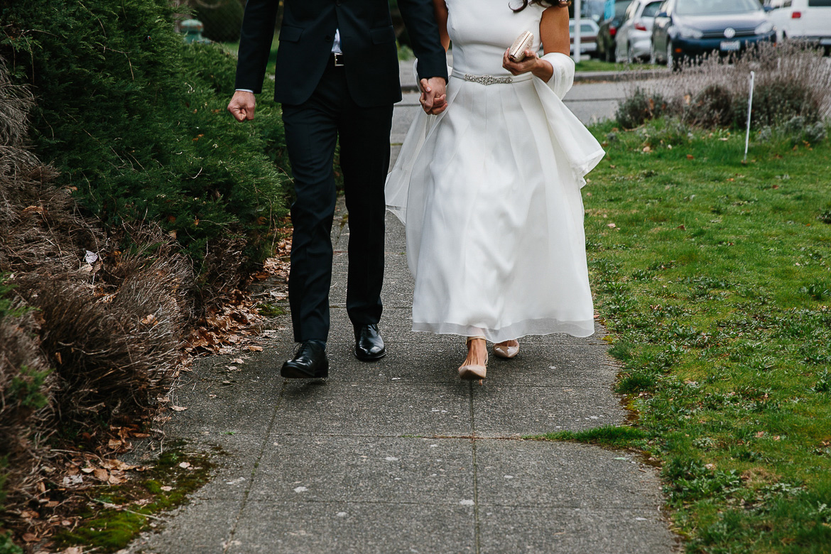 Bride and groom walking during portrait session on Beacon Hill