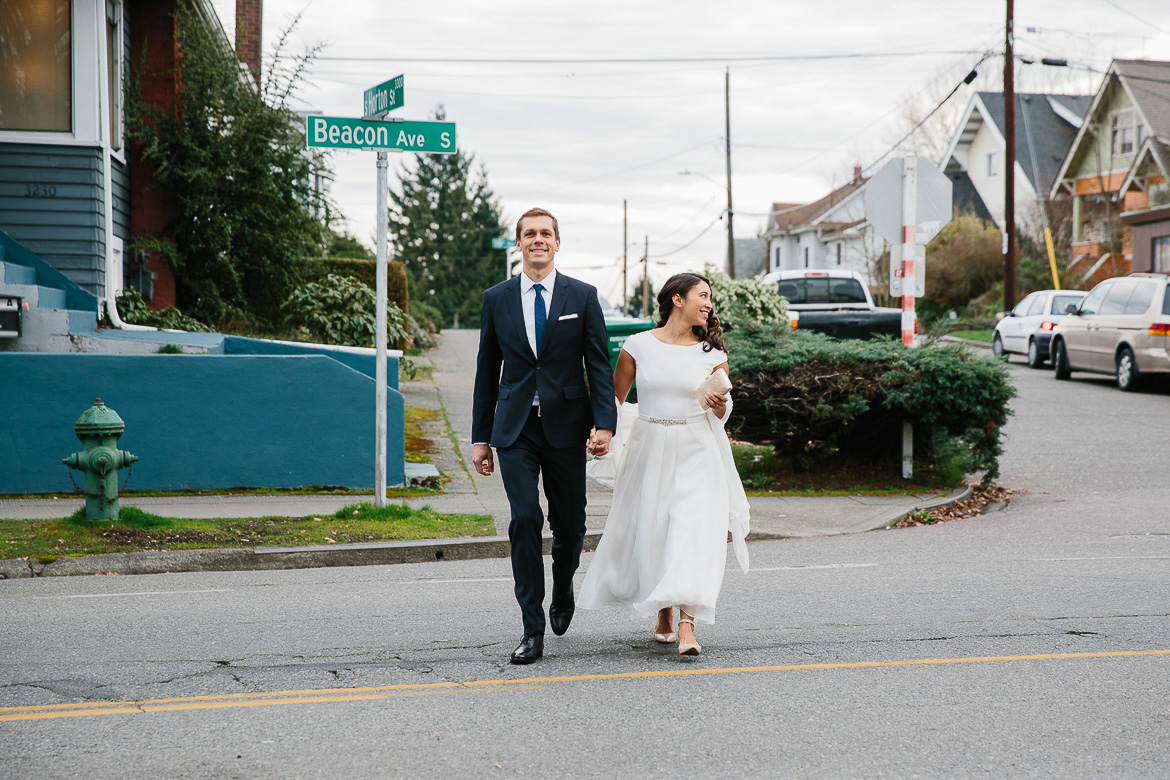 Bride and groom crossing the street during portrait session on Beacon Hill