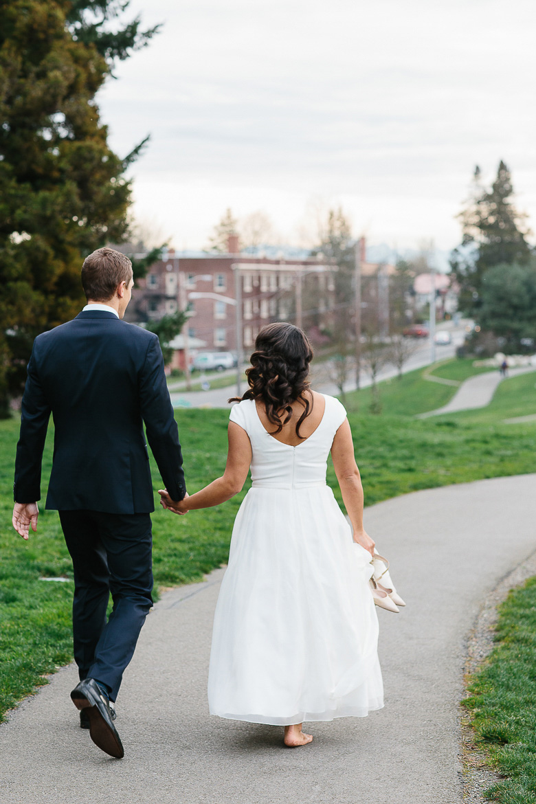 Bride and groom walking in Jefferson Park on Beacon Hill in Seattle