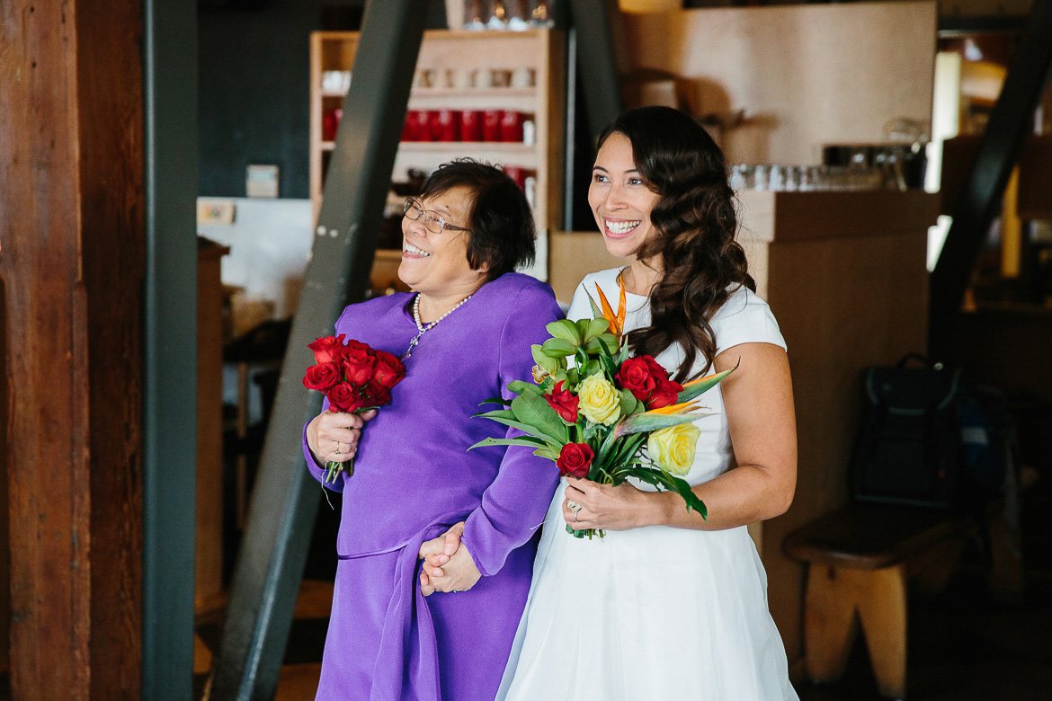 Bride walking down aisle during Pike Place Market elopement in Seattle, WA