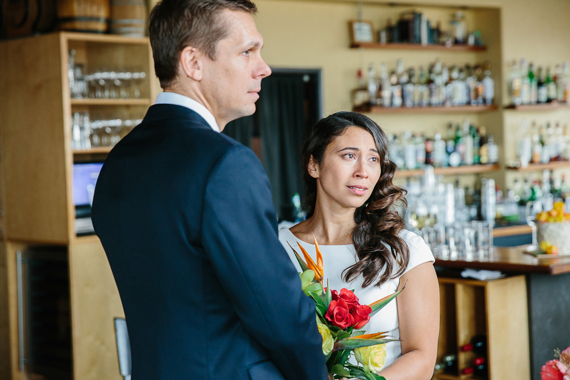 Bride emotional during elopement ceremony at Pike Place Market in Seattle, WA