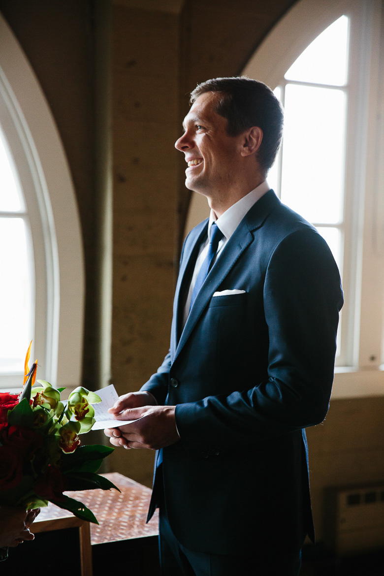 Groom laughing during his vows in a Seattle elopement ceremony