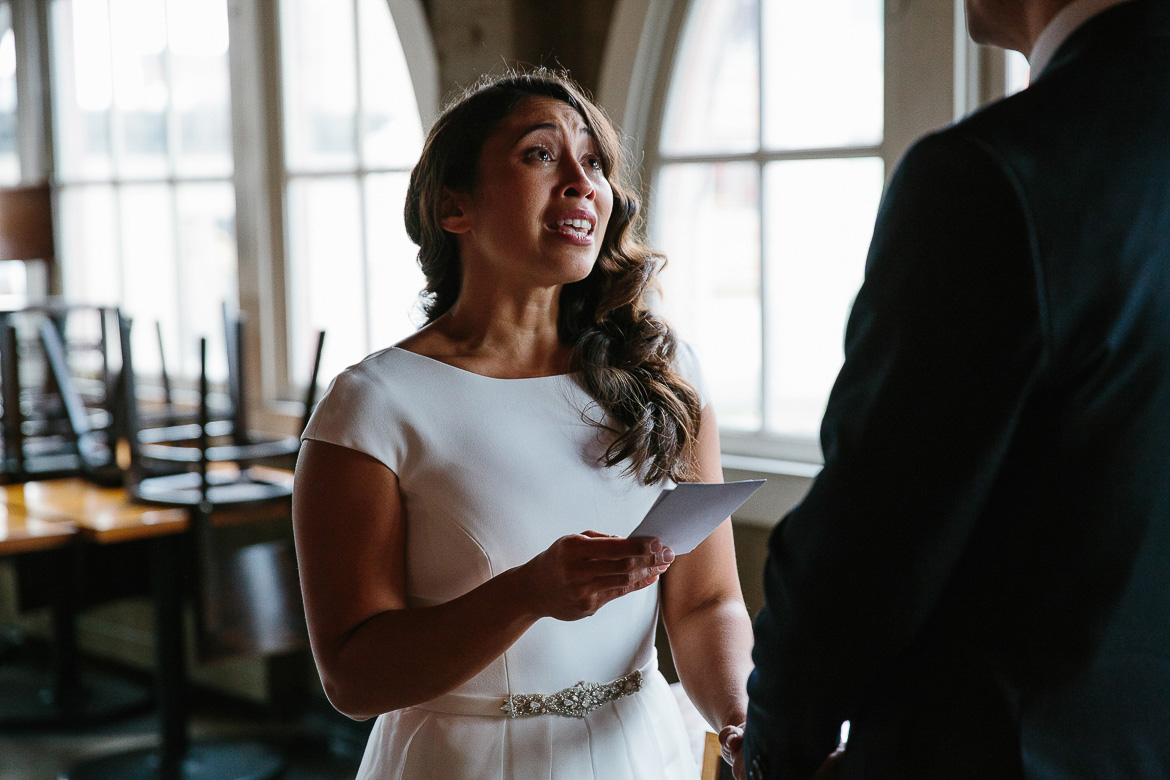 Bride crying during her vows for a Pike Place Market elopement ceremony
