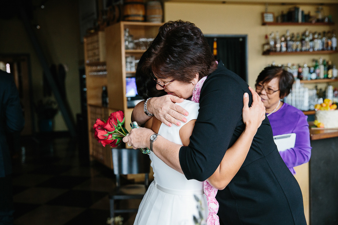 Bride and Mother of the groom share a hug after elopement ceremony in Seattle, WA