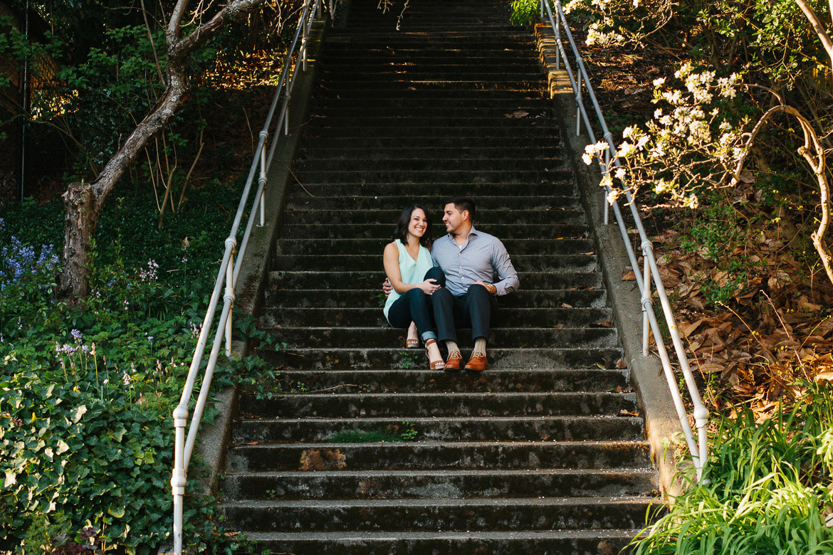 Seattle couple sitting on steps during photo session on Upper Queen Anne