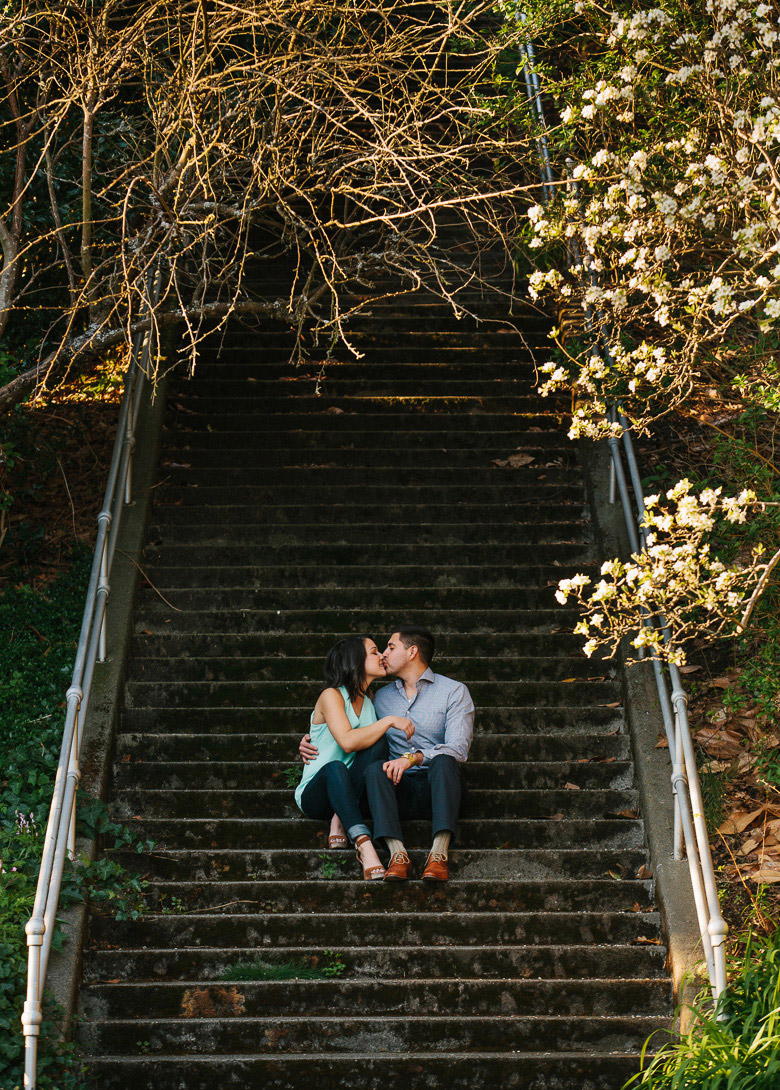 Seattle couple sitting on steps during photo session on Upper Queen Anne