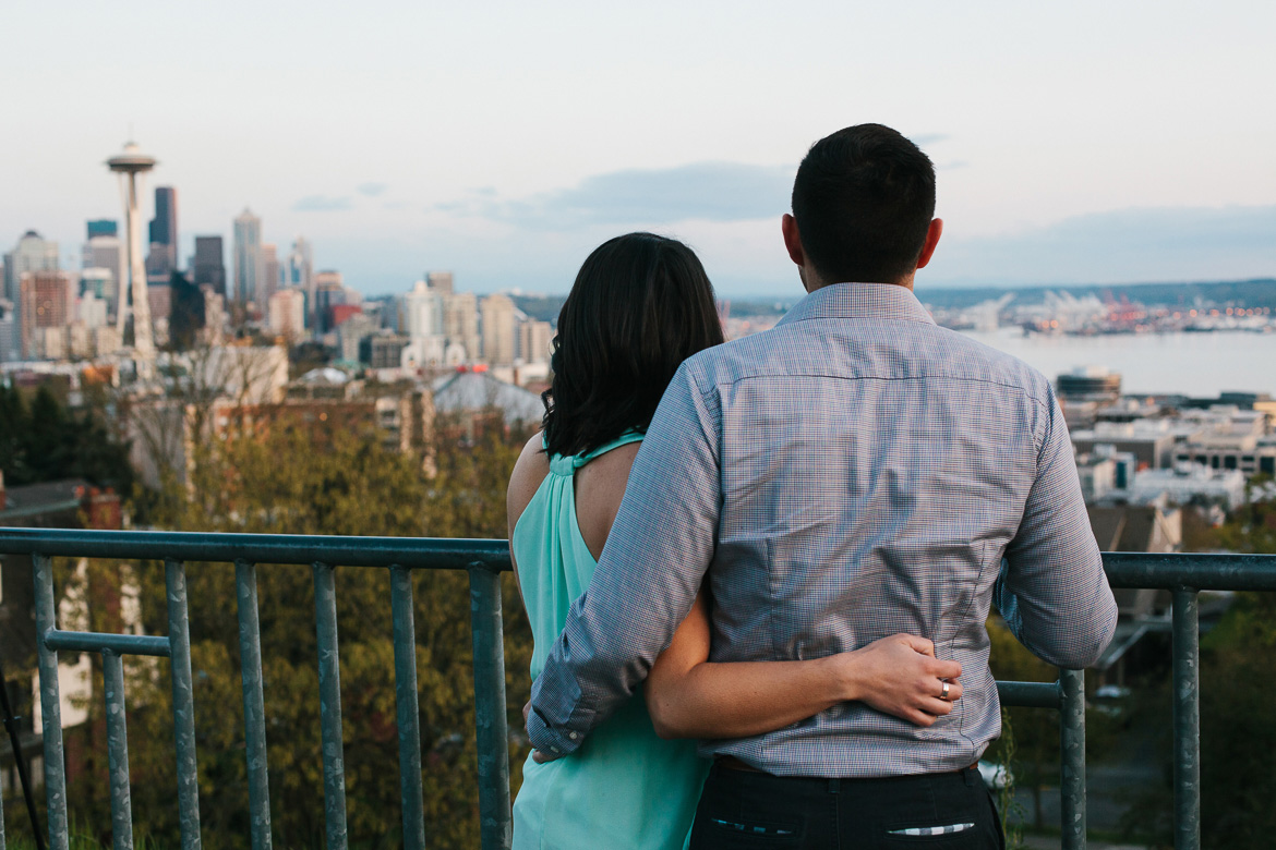 Seattle couple during sunset photo session on Upper Queen Anne at Kerry Park with city skyline