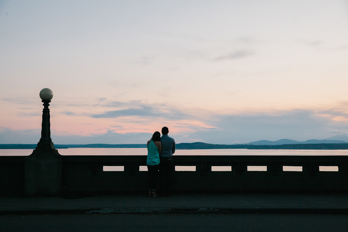 Seattle couple during sunset photo session on Upper Queen Anne Olympic Mountains view
