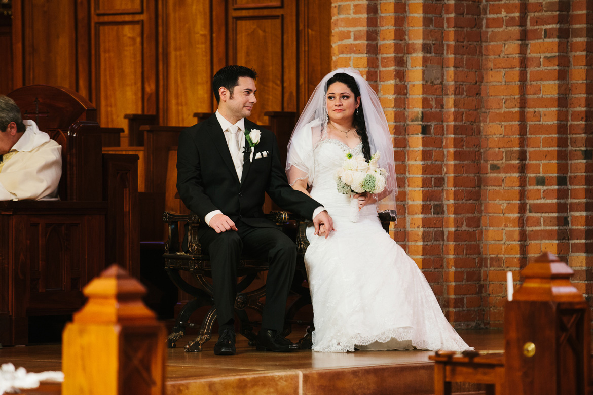 Bride and groom during wedding ceremony at Blessed Sacrament in Seattle, WA