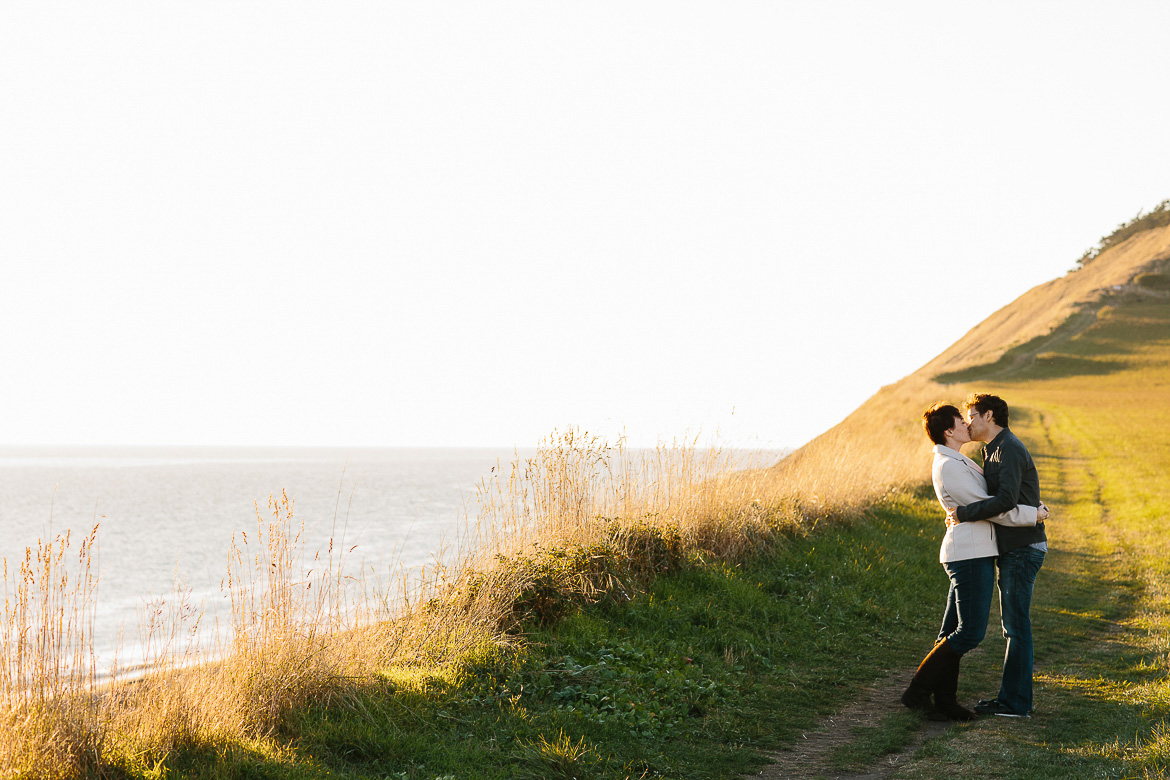 Couple kissing during engagement shoot at Ebey's Landing on Whidbey Island, WA
