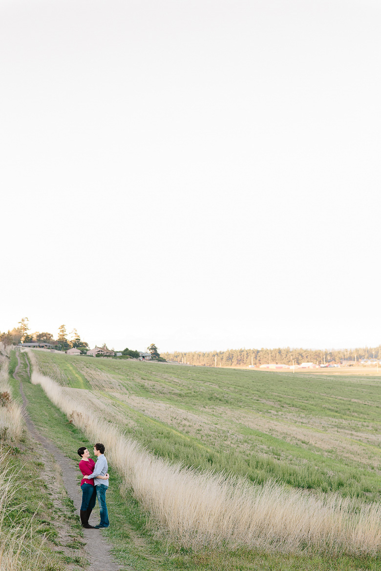 Couple laughing during engagement session at Ebey's Landing on Whidbey Island, WA