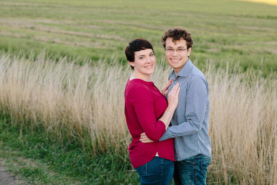 Couple smiling at camera during an engagement photo session on Whidbey Island, WA