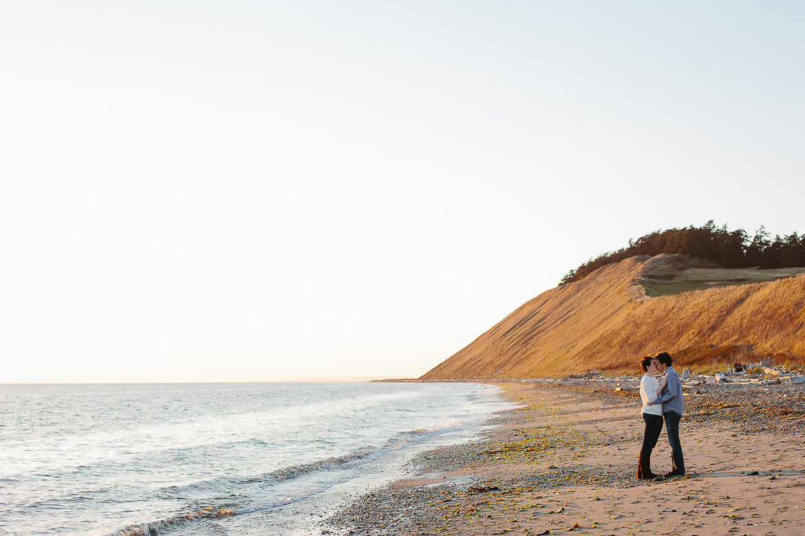 Couple on beach for engagement photos at Ebey's Landing on Whidbey Island, WA